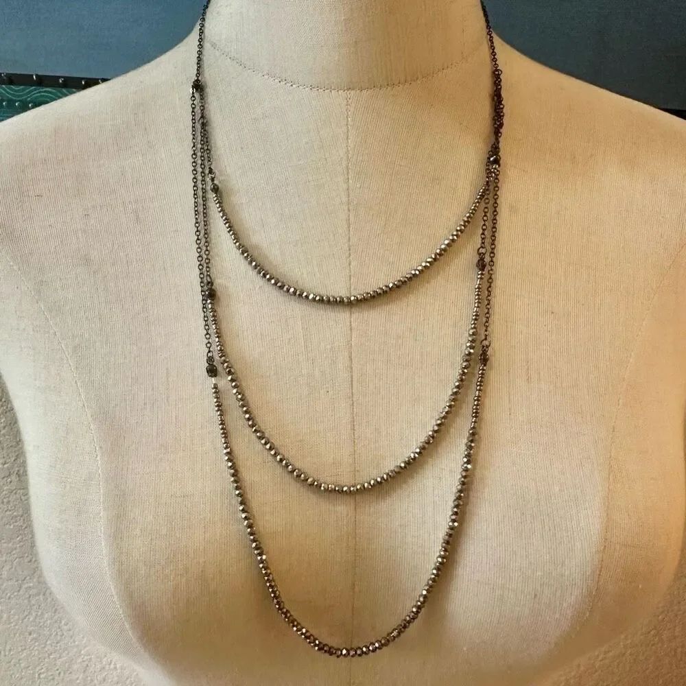 Triple strand silver beaded necklace